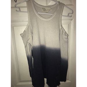 A blue and white sweater with shoulder cut outs